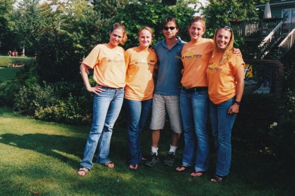 Group photo in orange Pine Vista t-shirts
