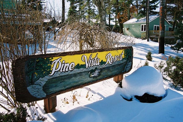 Pine Vista Resort sign.