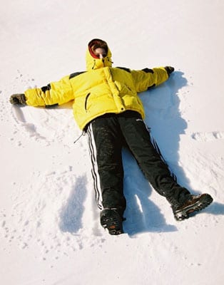Person making a snow angel.