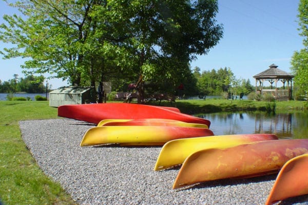 Canoes and kayaks on the shore.