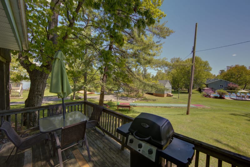 Lower Stoney patio with gas grill and patio table.