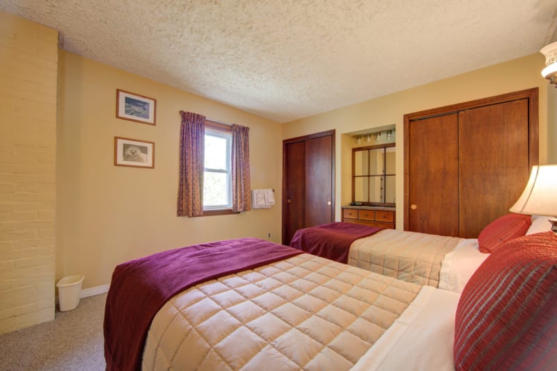Heritage Manor bedroom with two single beds.