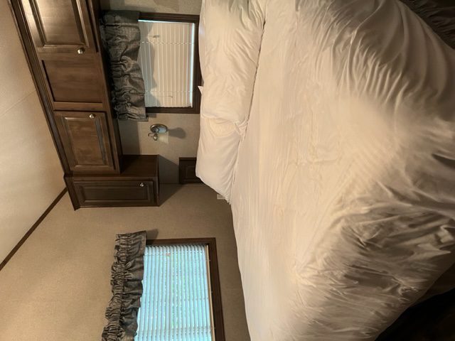 Bed with white bedspread